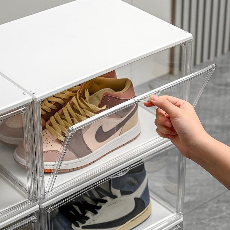 LED acrylic shoe box with a sneaker placed horizontally and the magnetic front panel open