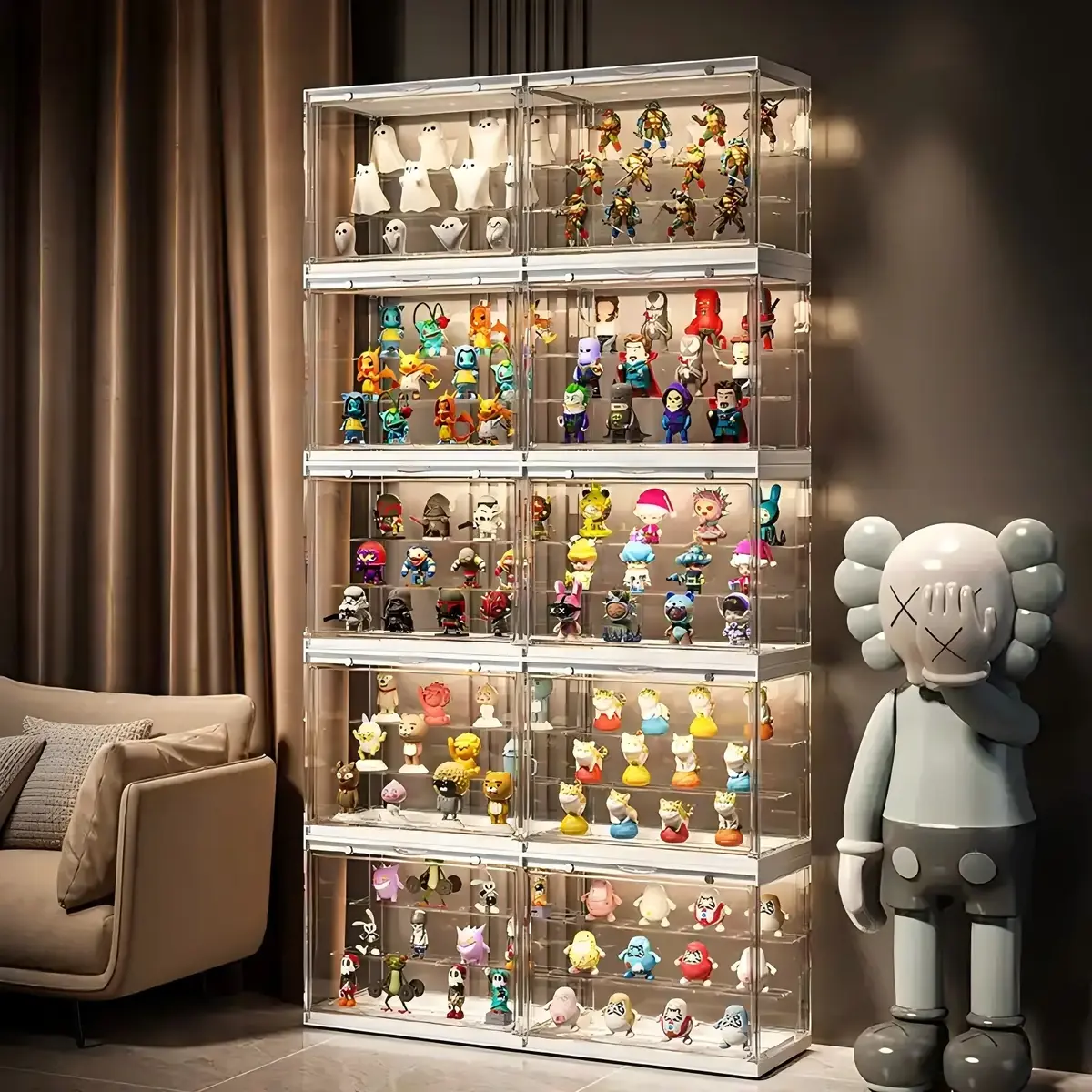 Tall floor-standing acrylic display cabinet filled with collectible figures