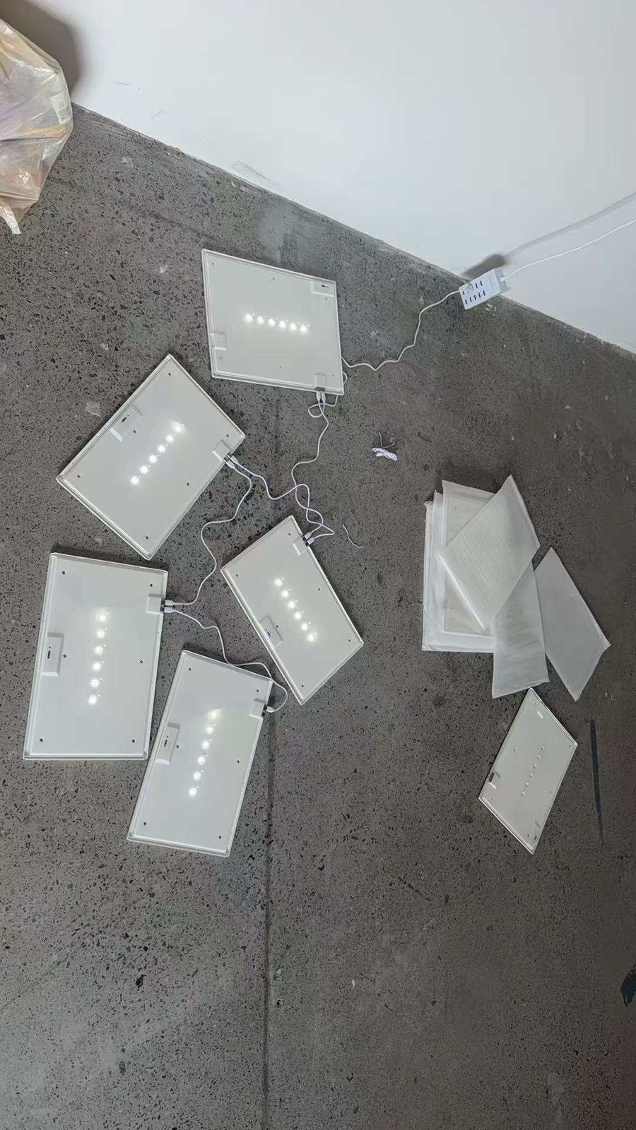 LED back panels daisy-chained for an acrylic display box wall installation